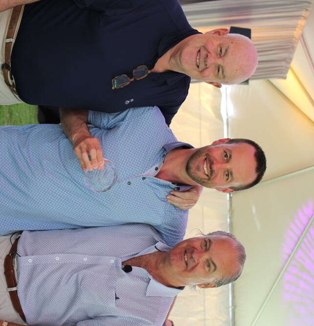 a group of men posing for a picture