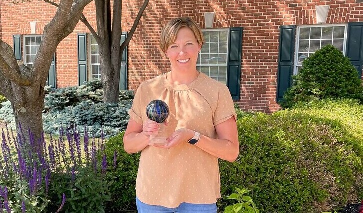 christy fisher with award